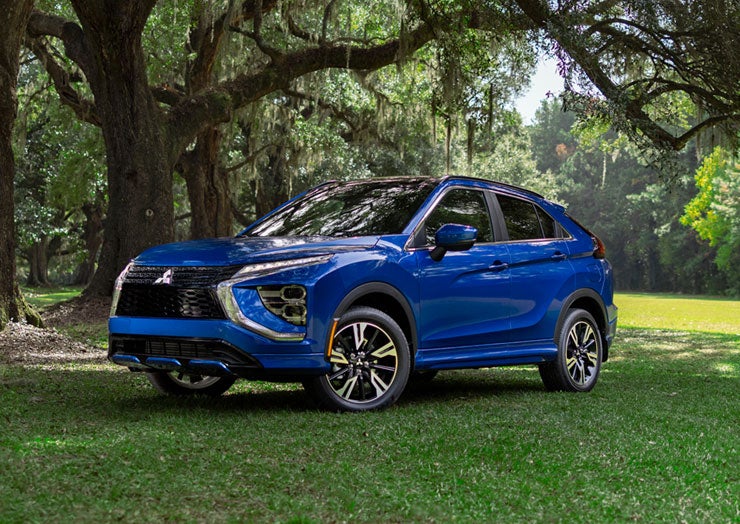 Front shot of the 2026 Outlander PHEV on a scenic road